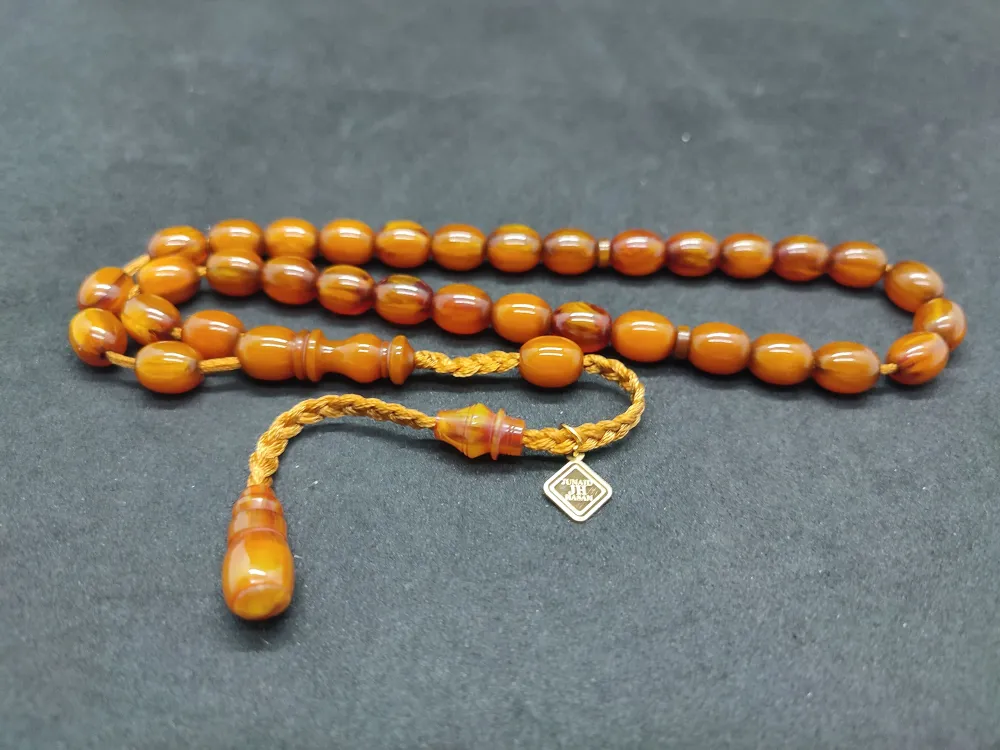 Junai̇d Hasan Usta Eseri̇ 12 Kat İpe Di̇zi̇lmi̇ş Anti̇k Model Eski̇ Sıkma Kehri̇bar küçük resim 3